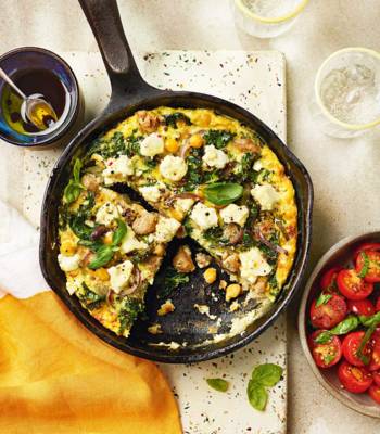 Sausage, chickpea and kale frittata with tomato salad
