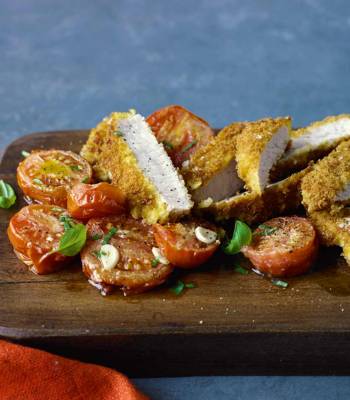 Parmesan-crumbed pork with roasted tomatoes
