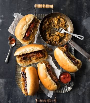 Sausages with beer-braised onions