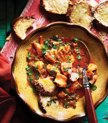 Mediterranean fish stew with cheese toasts