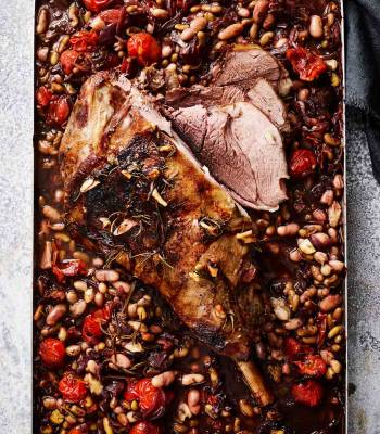 Slow-cooked leg of lamb with beans and tomatoes