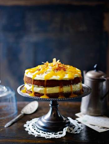 Coconut cake with mango cream cheese frosting and mango drizzle