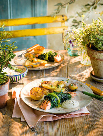 Baked salmon in chard with caramelised lemons, garlic and almond sauce