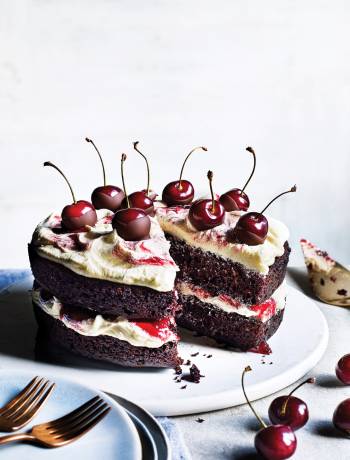 Vegan chocolate and cherry layer cake with vanilla frosting