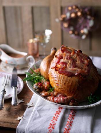 Roast turkey with cranberry stuffing and pigs in blankets