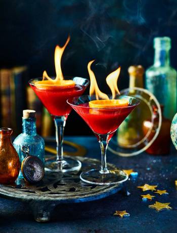 Flaming cranberry & orange cocktail