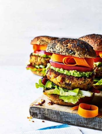 Stacked sweet potato burgers with avocado lime cream