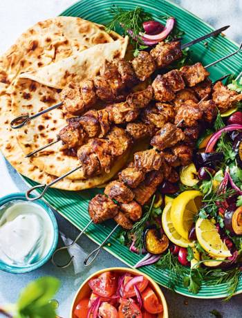 Mayo-marinated lamb skewers with aubergine, courgette and olive salad