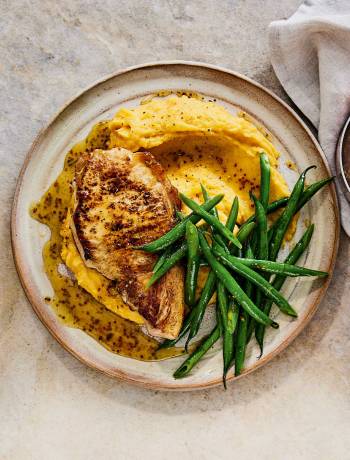 Marmalade-glazed pork chops with spiced carrot and swede mash