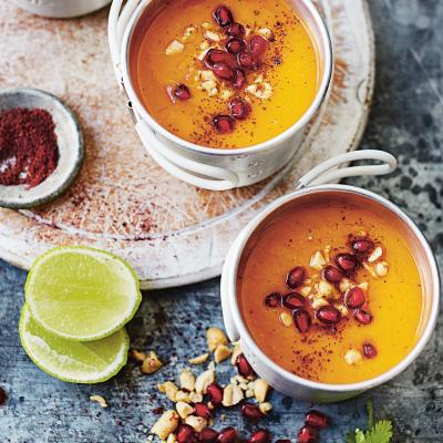 Sweet potato, sumac and pomegranate soup with roasted peanuts, coriander and lime