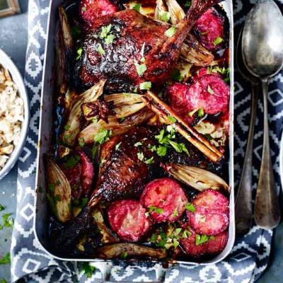 Sticky spiced duck legs with plums