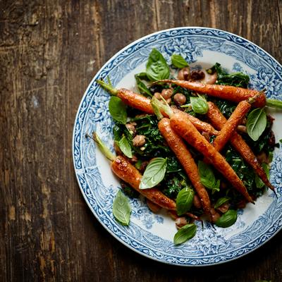 Warm carrot salad with spicy raisin and pine nut dressing