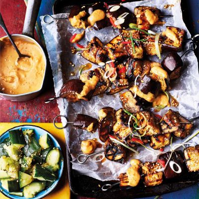 Aubergine skewers with satay sauce and smashed cucumber