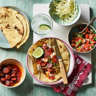 Chorizo tacos with salsa and feta