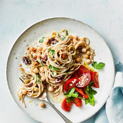 Tahini and olive spaghetti with tomato salad