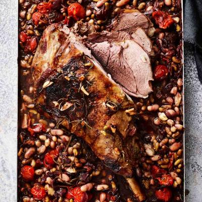 Slow-cooked leg of lamb with beans and tomatoes