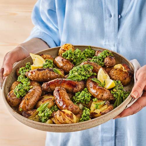 Bangers and 'smash' platter with minty pea pesto