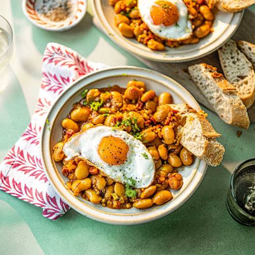 Saffron-braised butter beans with chorizo and fried eggs