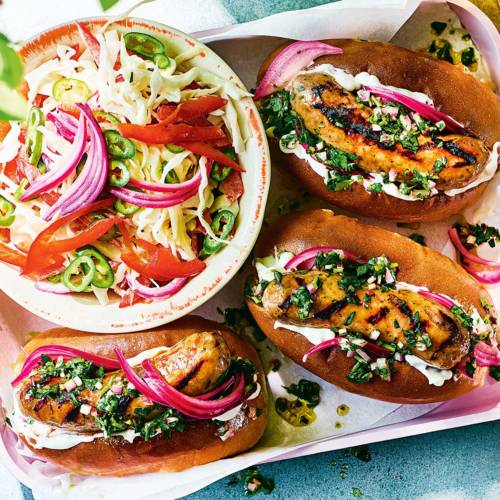 Chimichurri hot dogs with pickled pink onion and pepper slaw