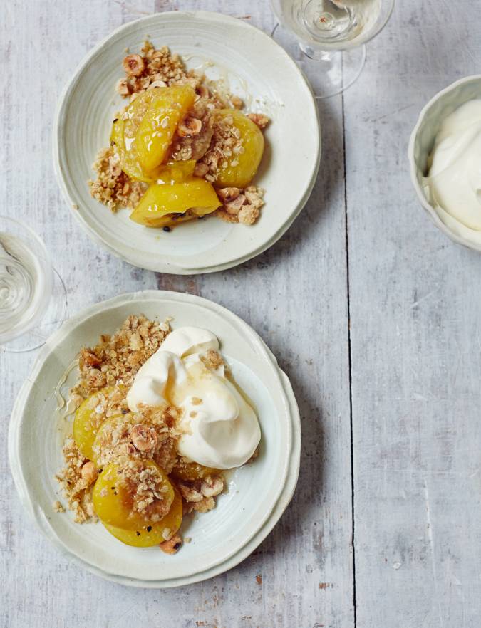 Recipe: Baked plums with cardamom and honey, oat crumble and whipped cream