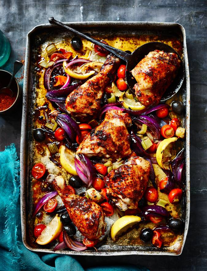 Recipe: Harissa-spiced chicken legs roasted with lemons, tomatoes and celery