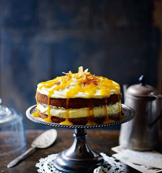 Coconut cake with mango cream cheese frosting and mango drizzle