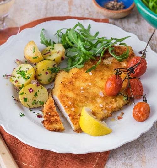 Chicken Parmesan with rocket and new potato salad