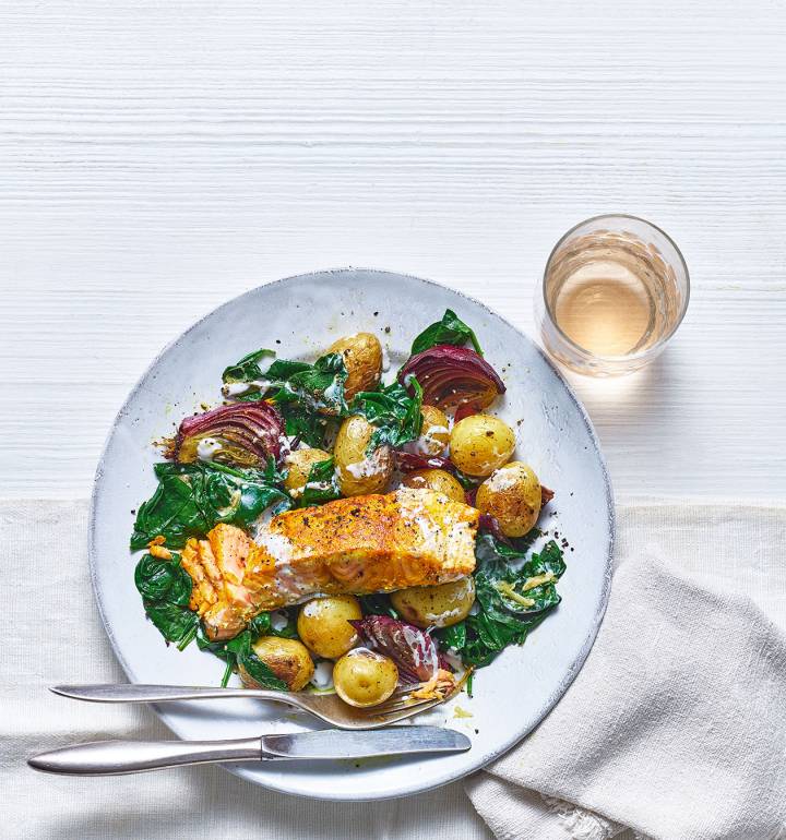 Turmeric salmon with warm saag aloo salad