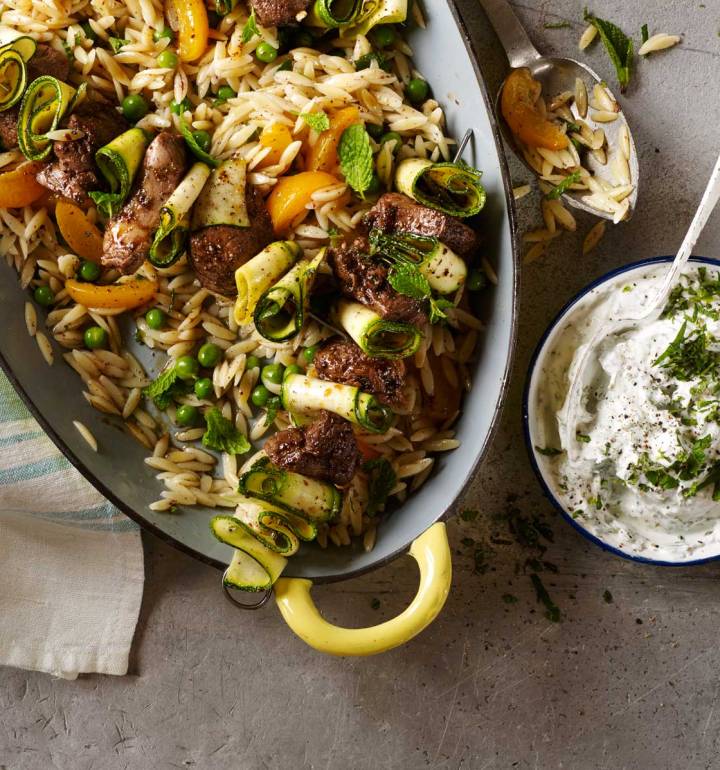 Lamb kebabs with pea, apricot and mint orzo and garlic yogurt