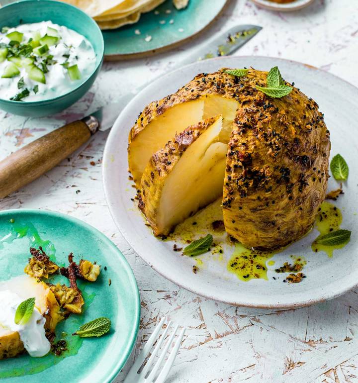 Slow-roast spiced whole celeriac with raita