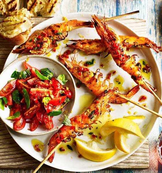 Lemony prawn skewers with tomato, chilli and oregano