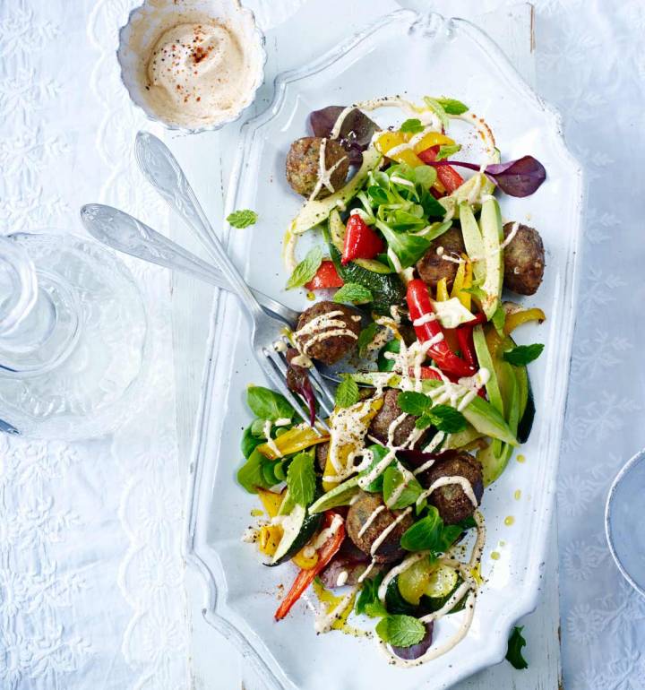 Falafel with avocado, roasted vegetables and tahini dressing