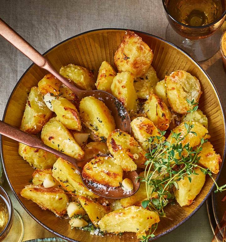 Crispy roast potatoes with thyme and garlic recipe | Sainsbury`s Magazine