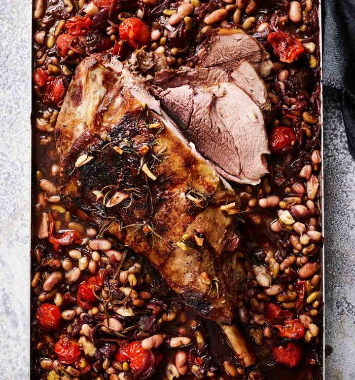 Slow-cooked leg of lamb with beans and tomatoes