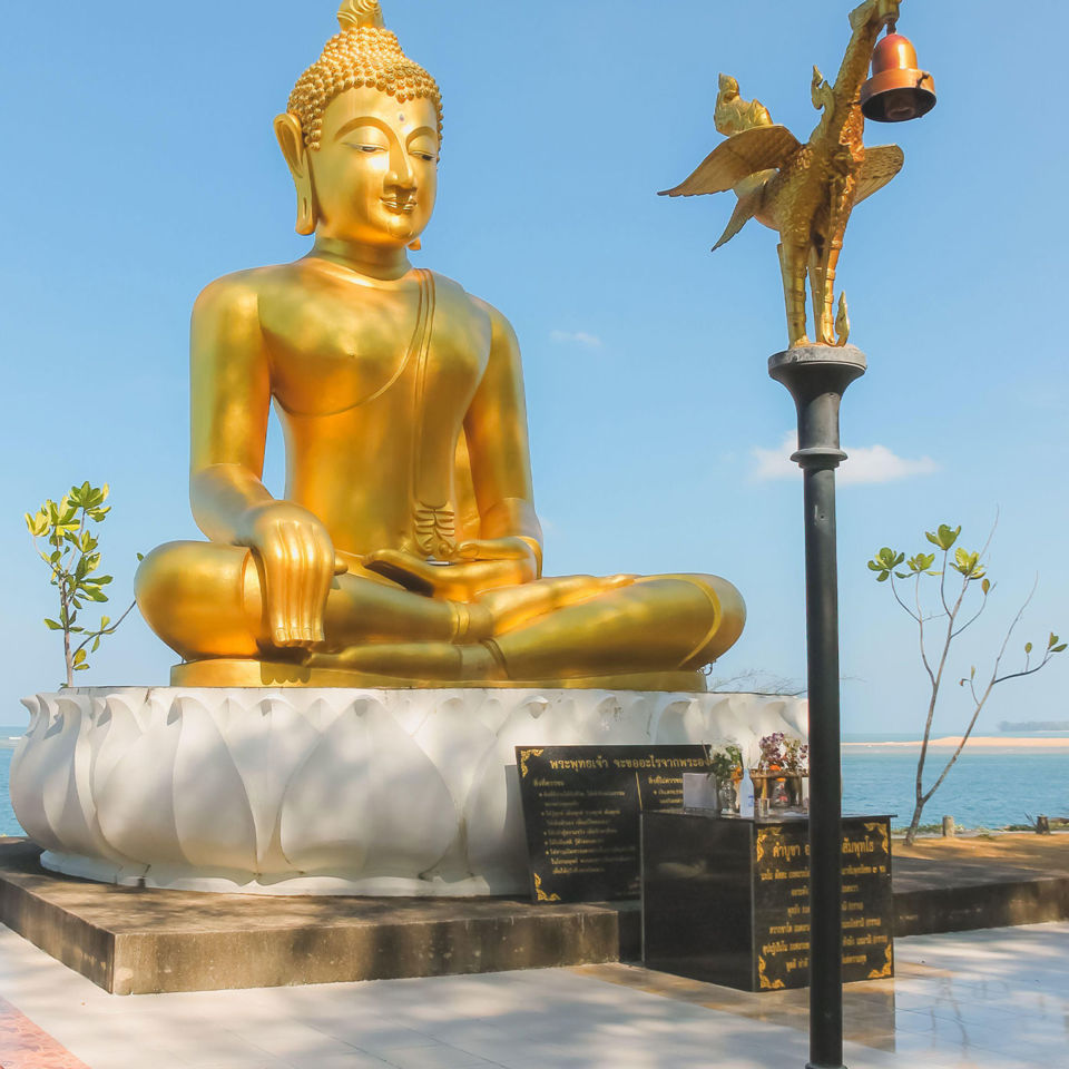 Gold buddha statue commemorating tsunami victims in Takua Pa