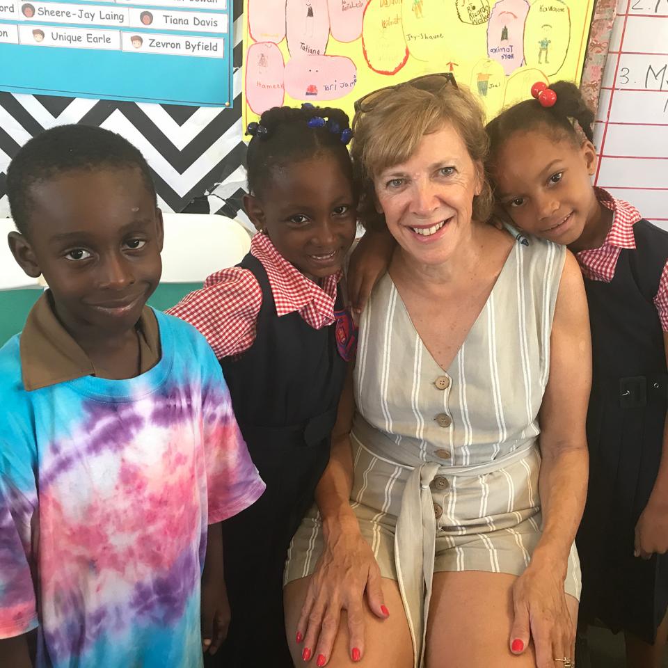 Mitzie and local children as part of the Reading Road Trip
