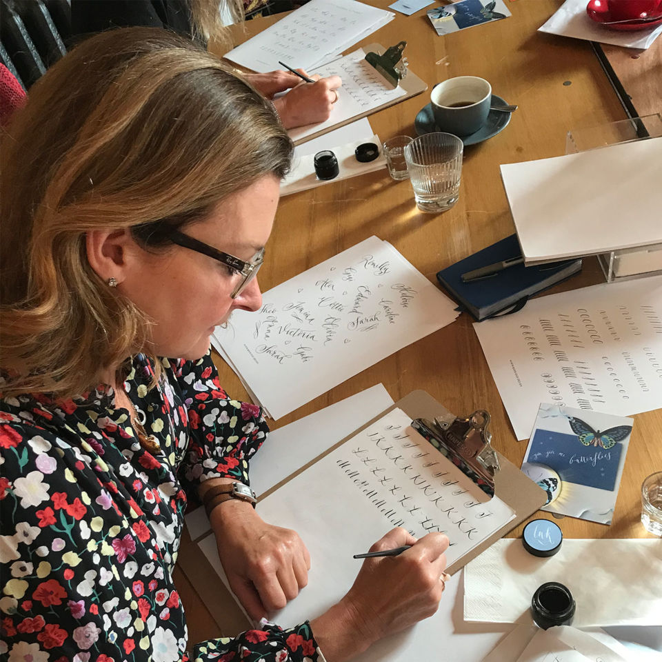 Kate trying her hand at calligraphy