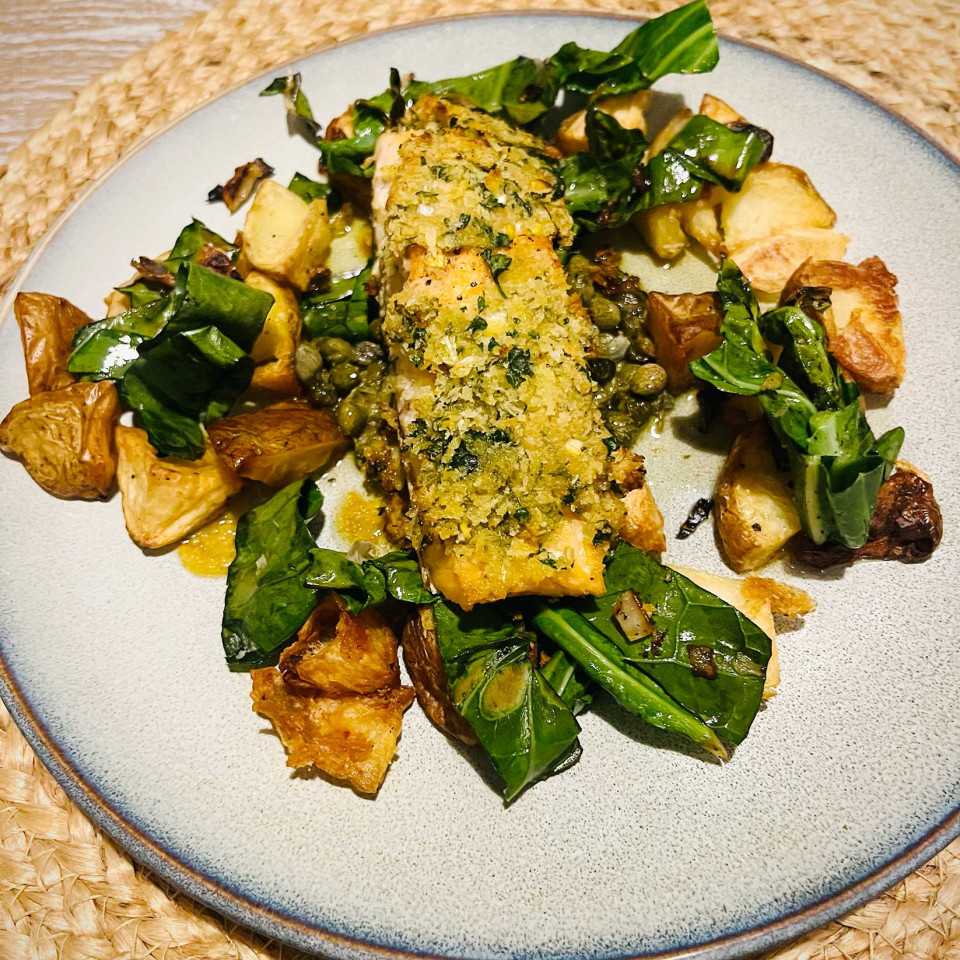 Herb-crusted salmon with garlic-infused potatoes and autumn greens