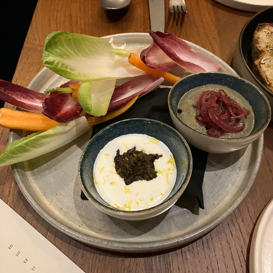Whipped feta with black olive harissa & charred courgette and tahini dips