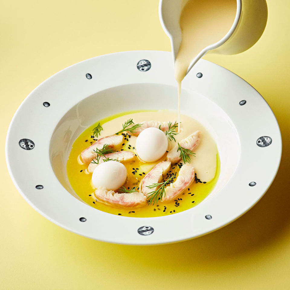 Smoked eel chowder with quail eggs and curry butter