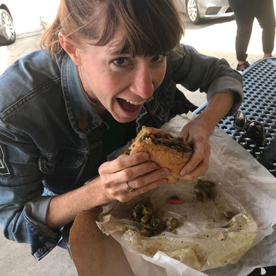 Lisa tucks into a salt beef sandwich in Chicago