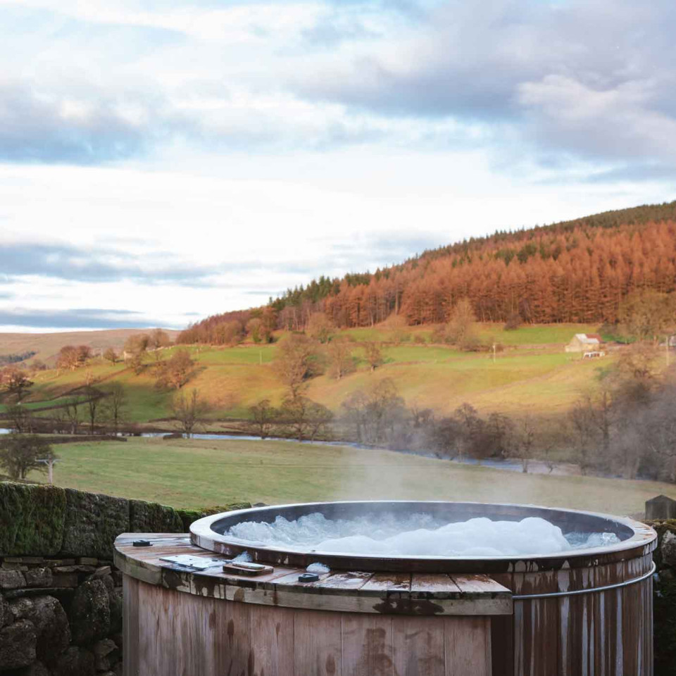 The hot tub with a view at Wesleyan Cottage