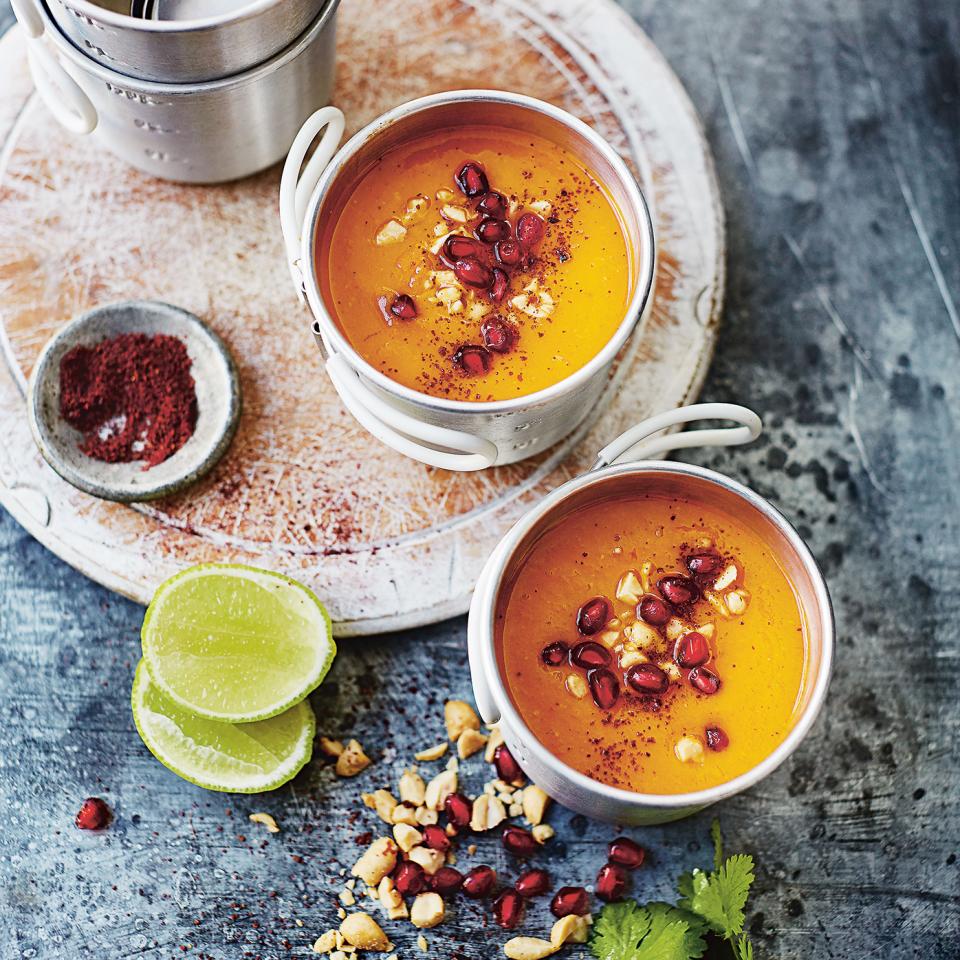 Sweet potato, sumac and pomegranate soup with roasted peanuts, coriander and lime