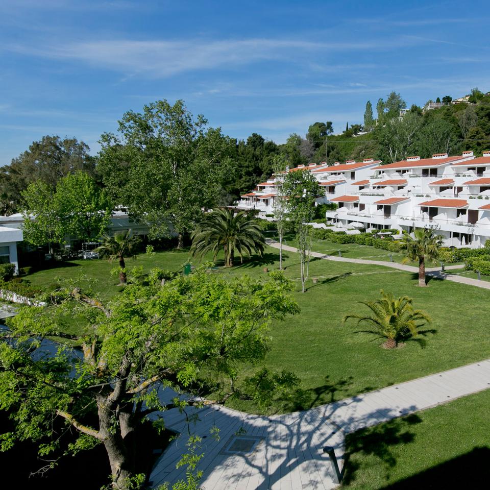 Manicured lawns surround the hotel