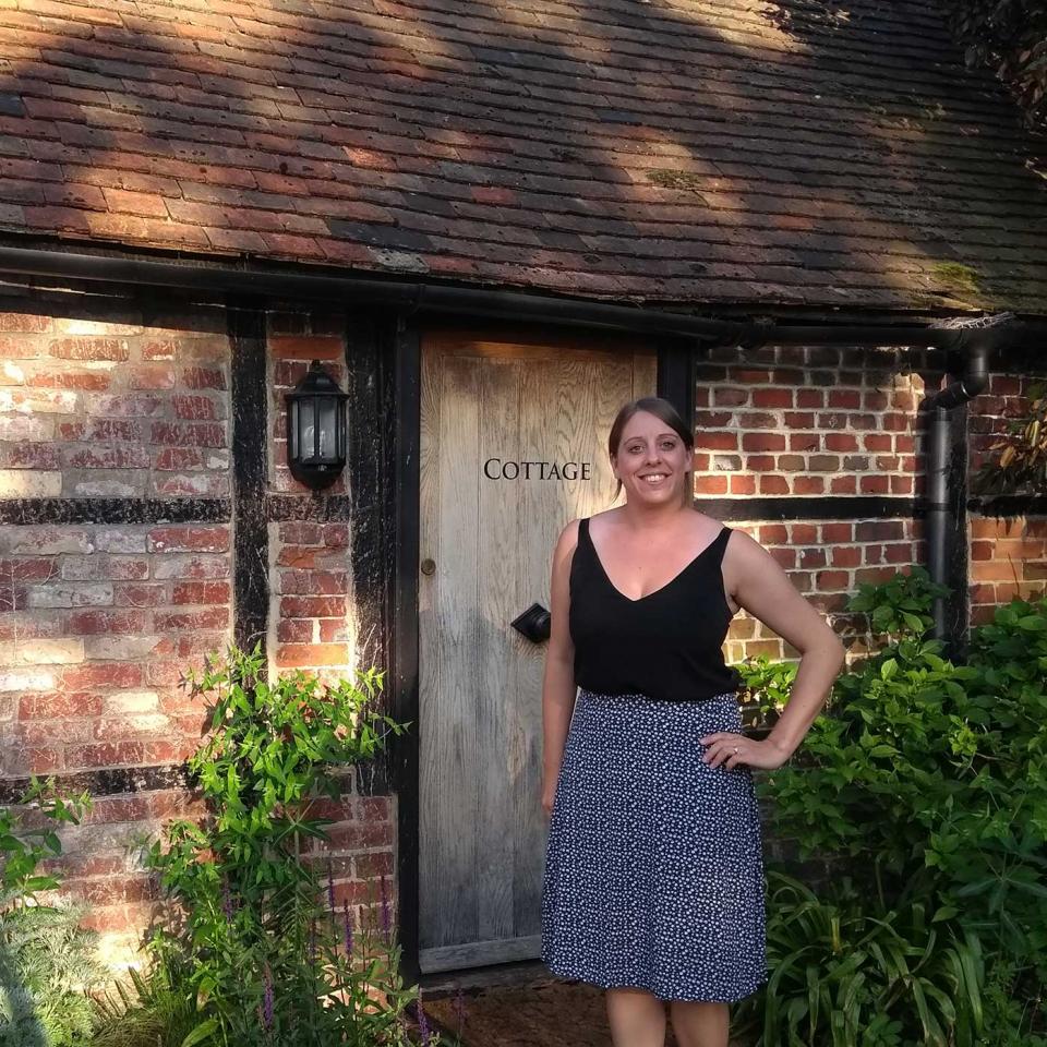 Liz outside Cook's Cottage