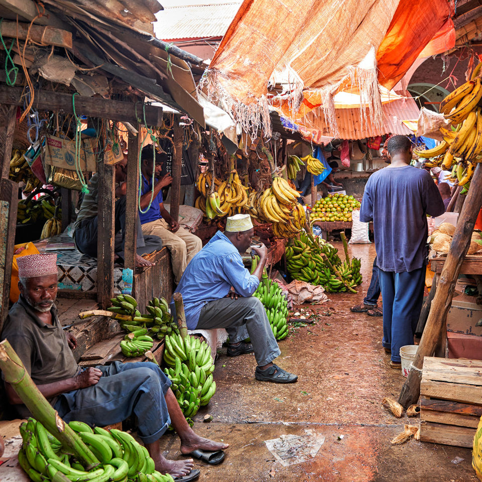 Fruit and veg piled high on the market stalls in Stone Town