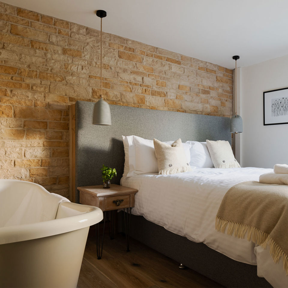 the distinctly Cotswolds palette in the guest bedrooms