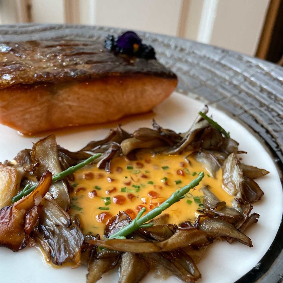 Joely’s salmon main served with hen of the woods and a lobster sauce