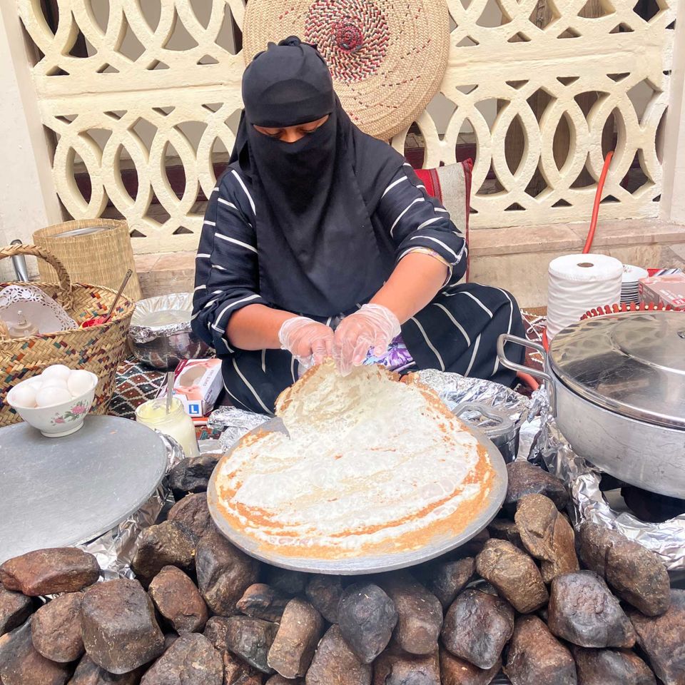 Making traditional regag bread at Al Khayma Heritage Restaurant