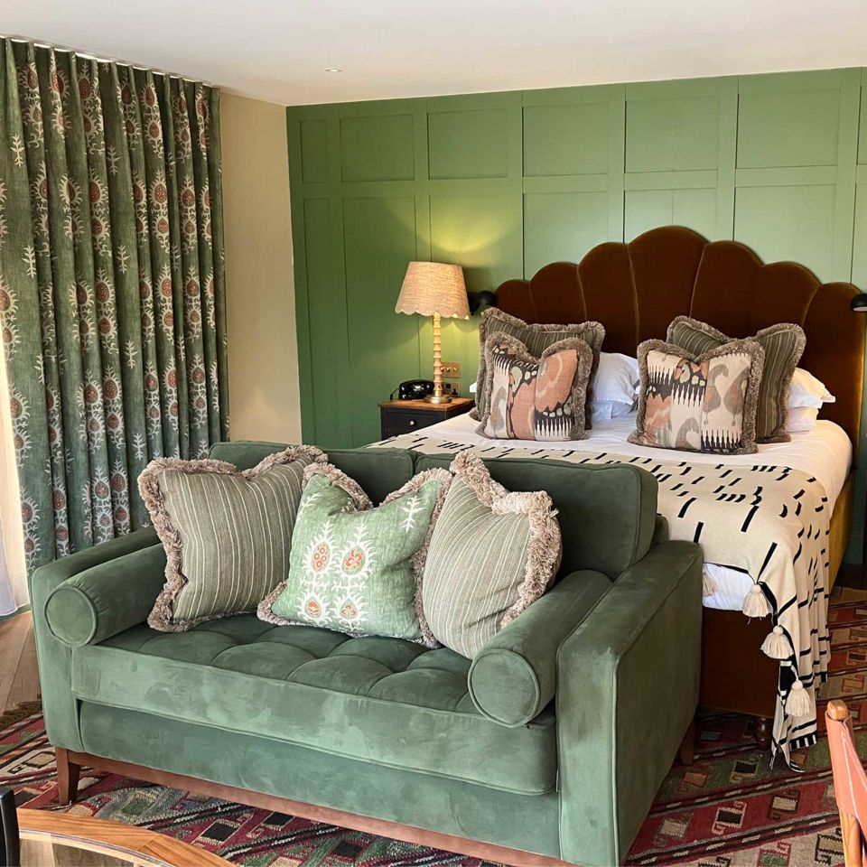 A super-plush bed and sofa in the bedroom